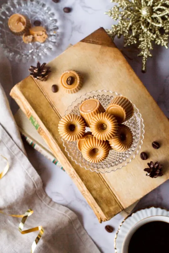 Caramelized white chocolate Belgian pralines in a small glass jar.