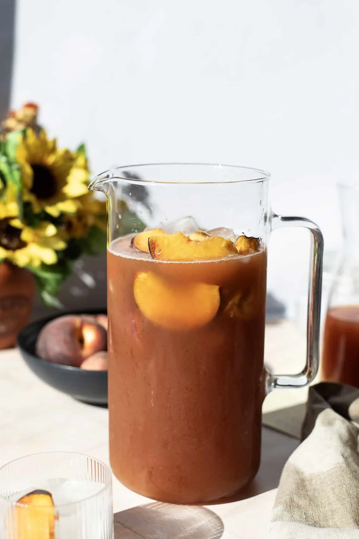 A pitcher of bourbon peach tea.
