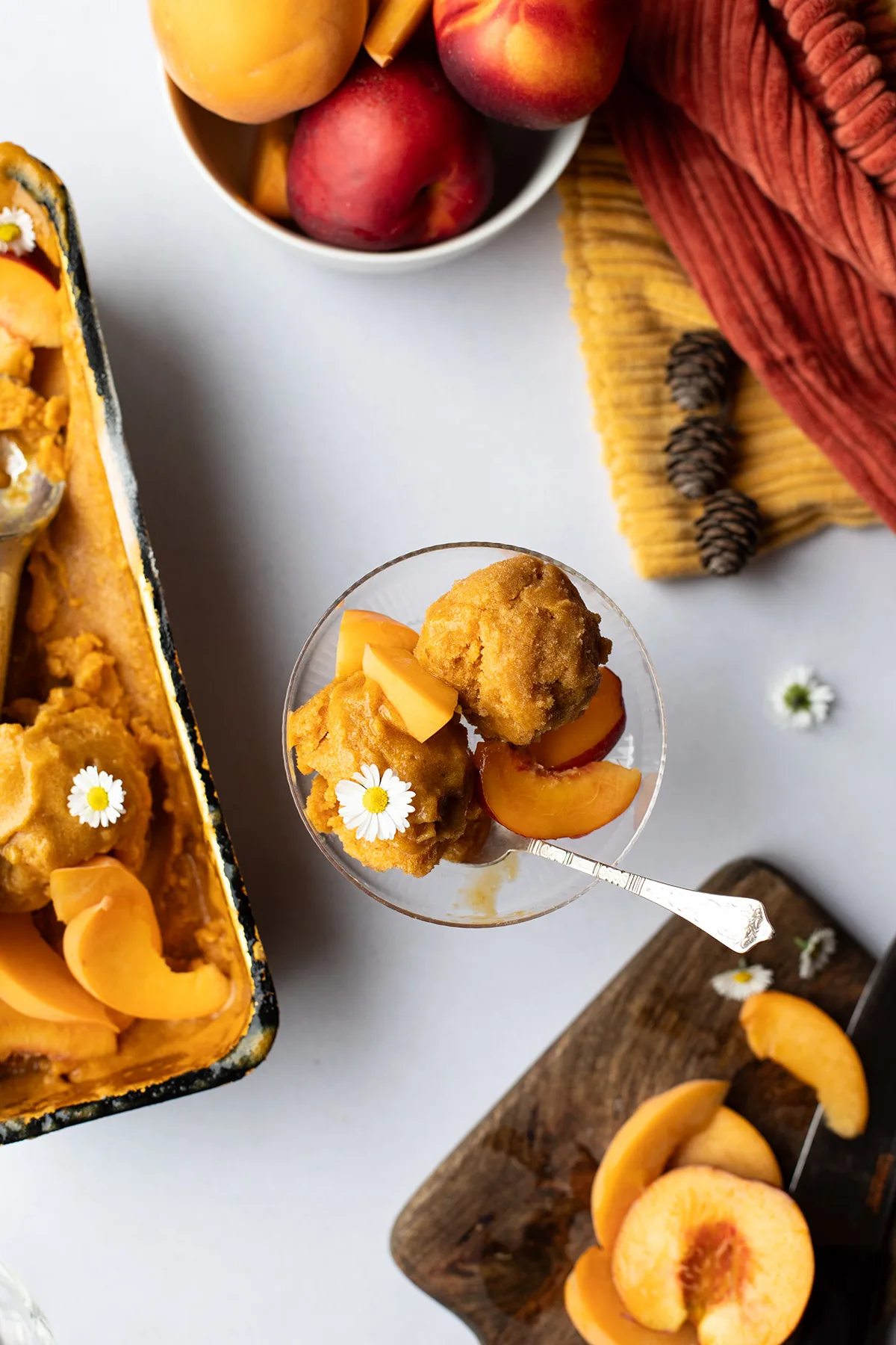 Brown sugar peach sorbet served in a coupé glass seen from above.