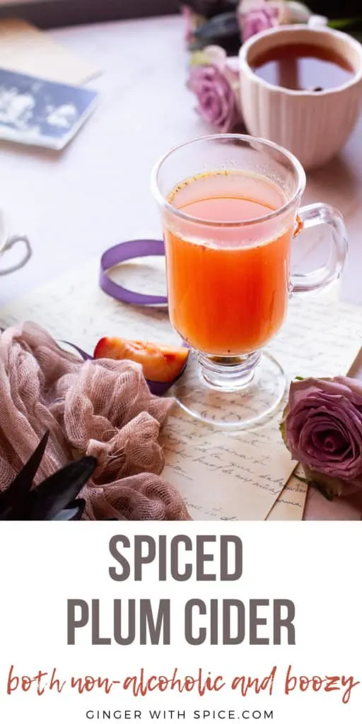A glass cider mug with a bright orangey plum cider. Title text below. Pinterest pin.