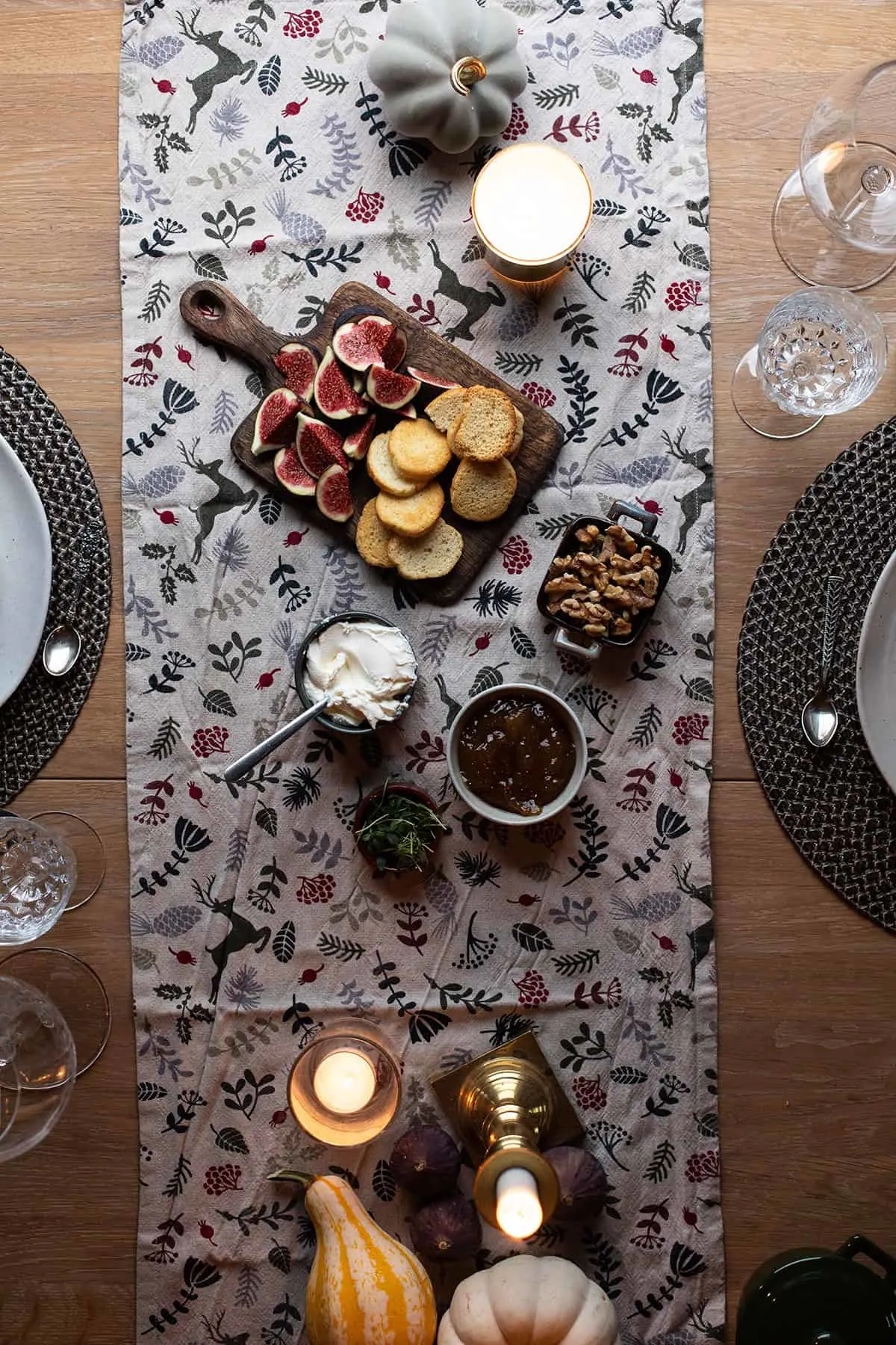 Table set for fig jam crostini appetizer.