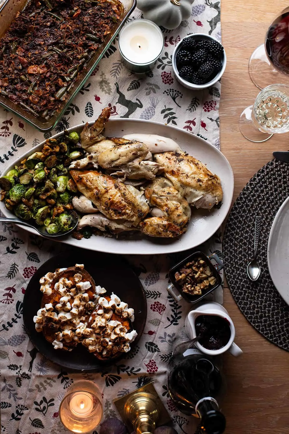 Carved chicken on a plate, sweet potato boats next to it.