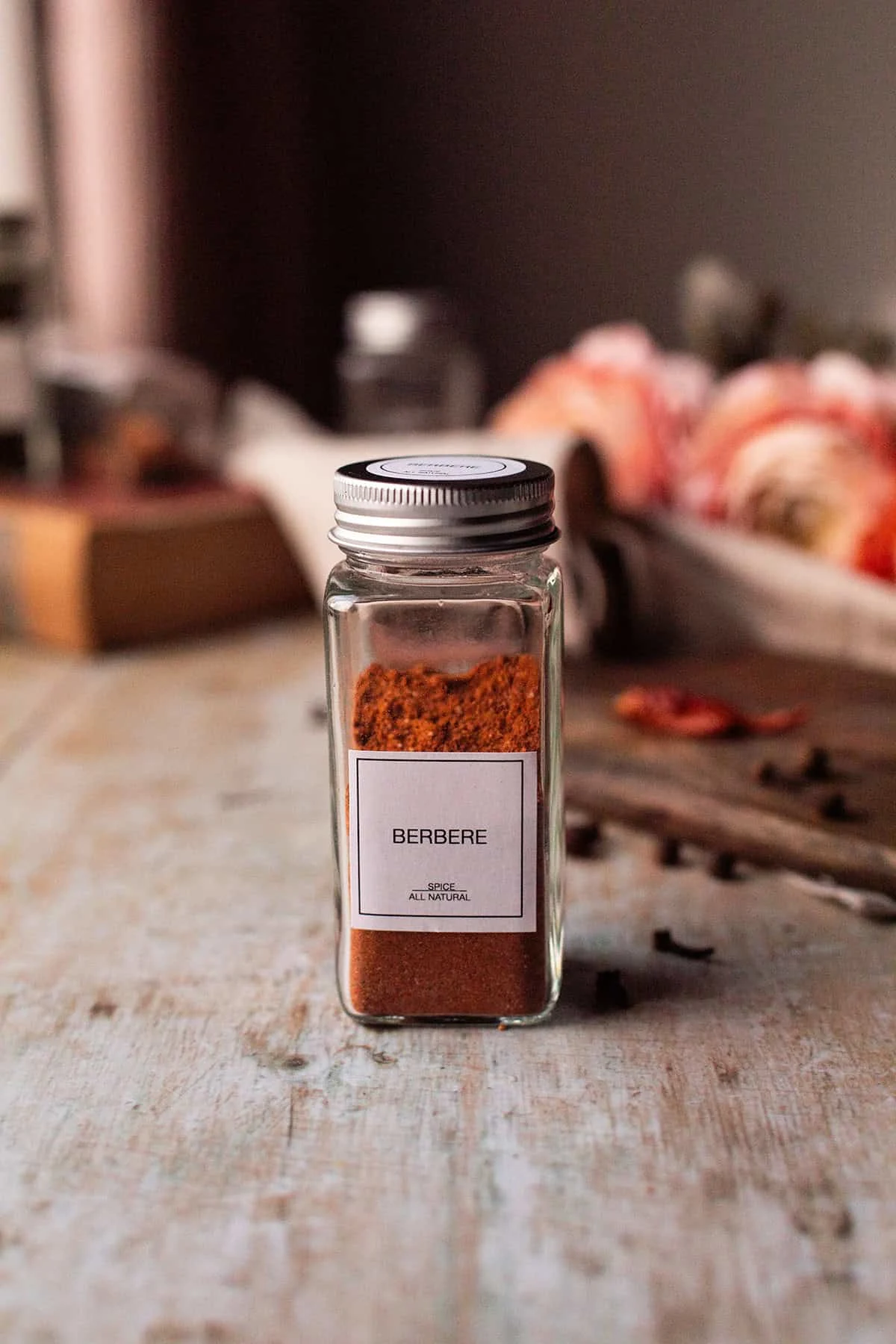 Spice jar with berbere mix in it.