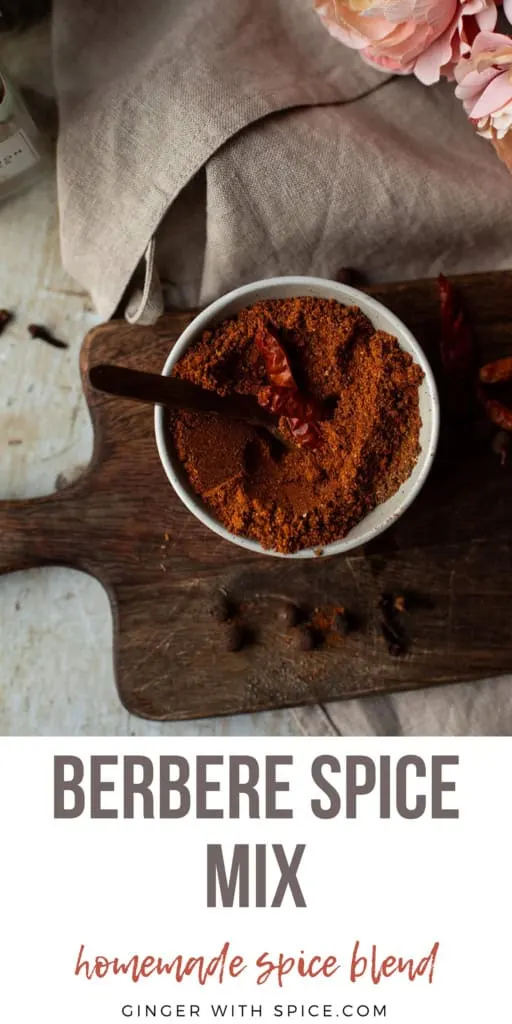 Small bowl with berbere spice mix with the title text below. Pinterest pin.