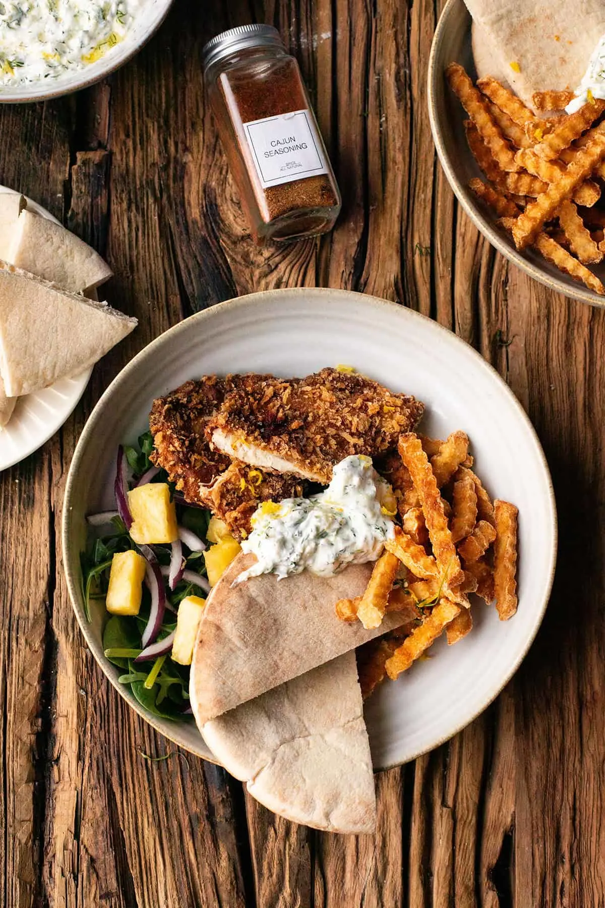 Cut open chicken fillet with panko breading.