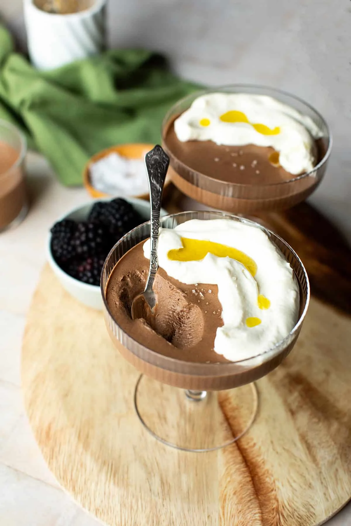 Spoon taken a bite out of a chocolate mousse.