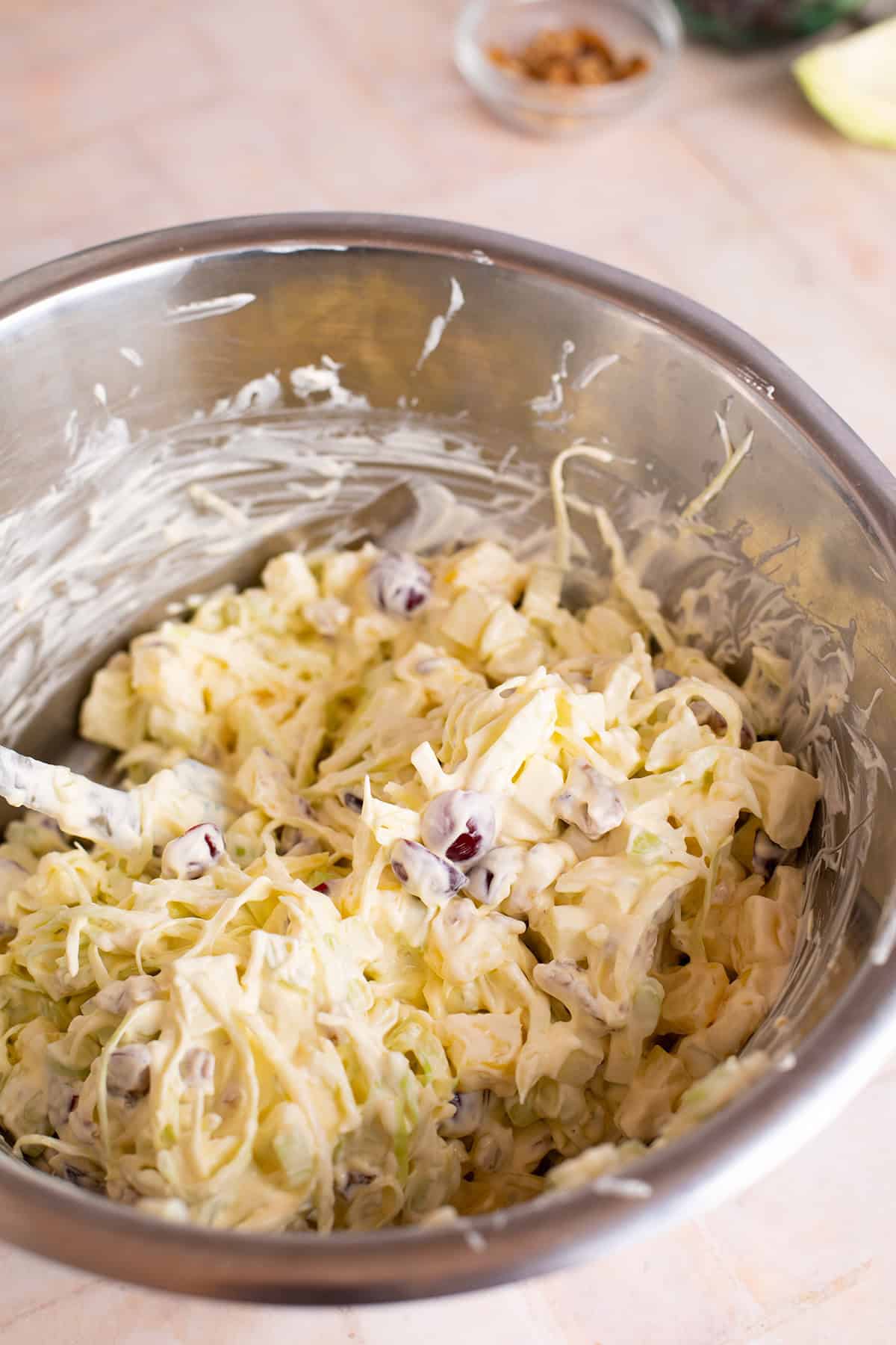 A large metal bowl showing the mixing of the ingredients.