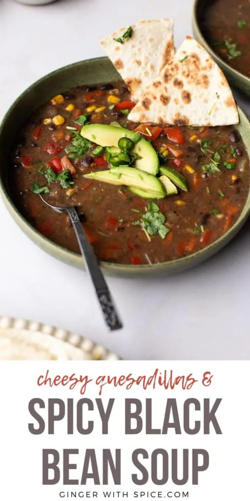 Spicy black bean soup in a green bowl. Pinterest pin.