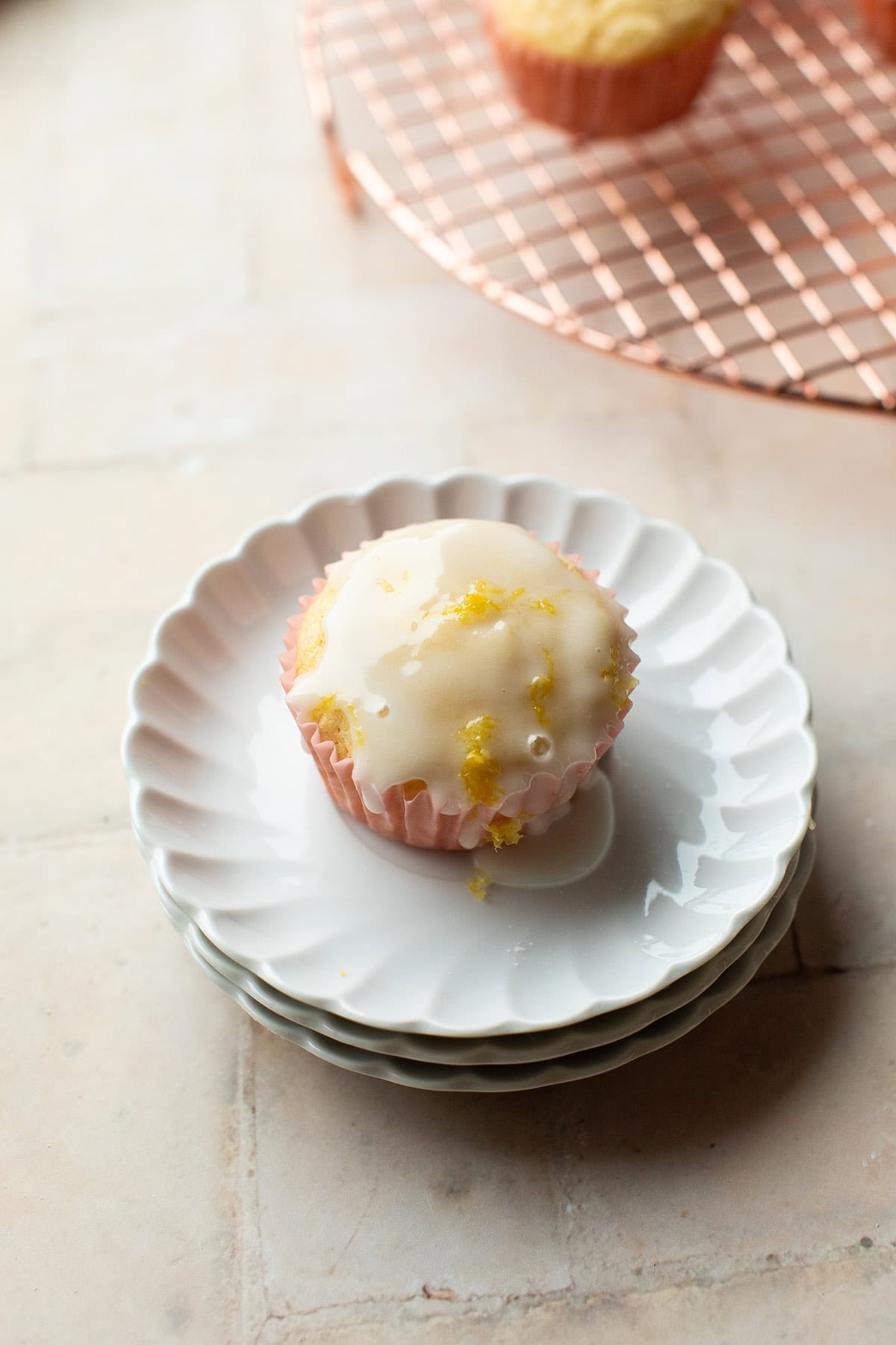 Close-up of one muffin with lemon glazing.