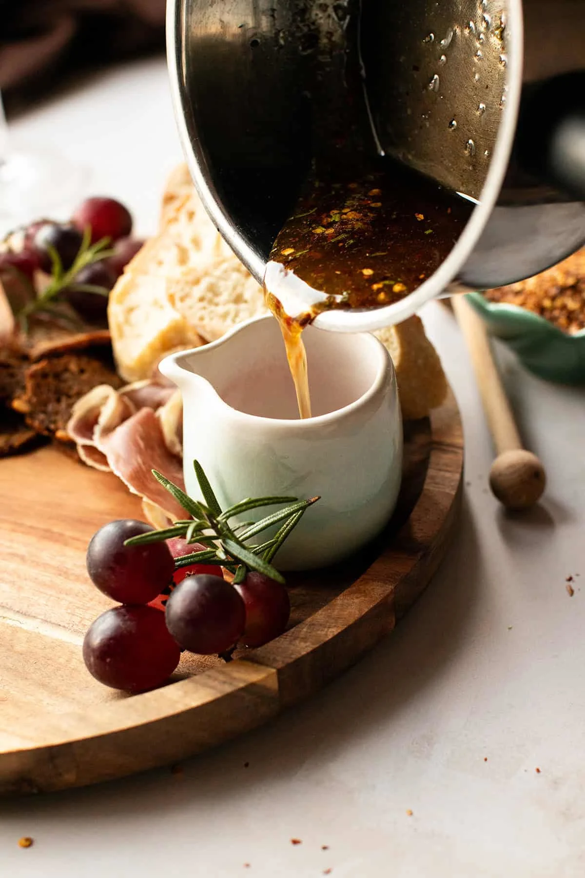 Pouring hot honey in a jar.