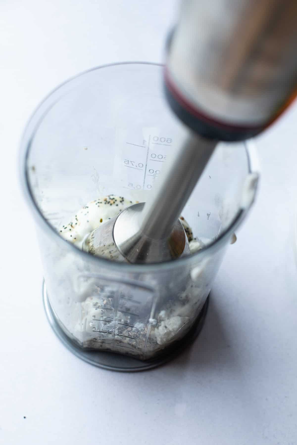 Immersion blender in the dip.