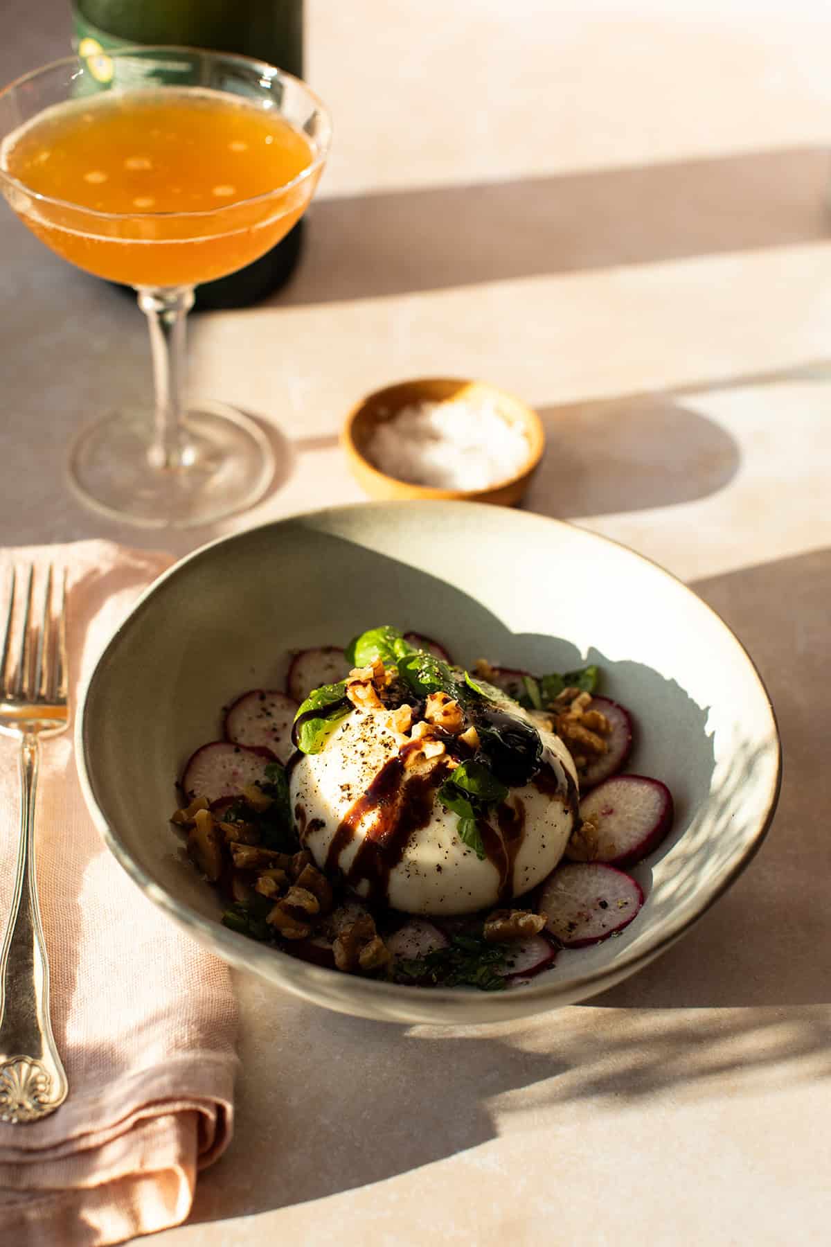 Burrata appetizer with radishes.