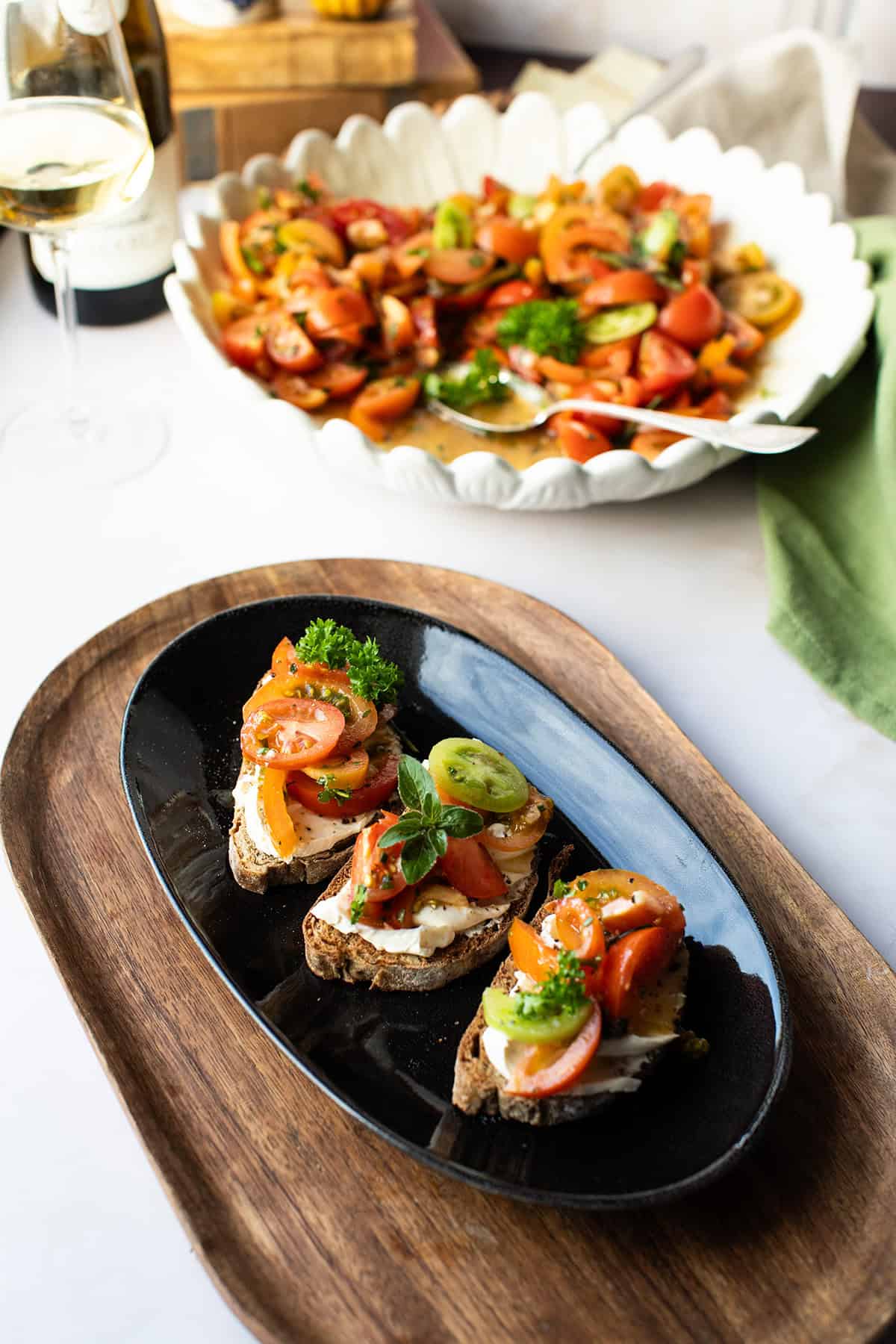 Three bruchetta with marinated tomatoes.