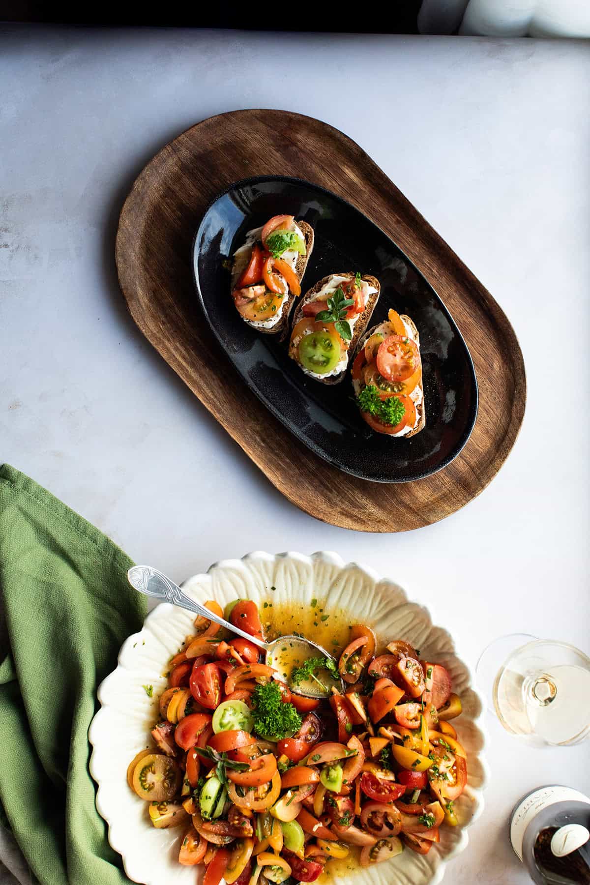 Three small bruschetta with marinated tomatoes.