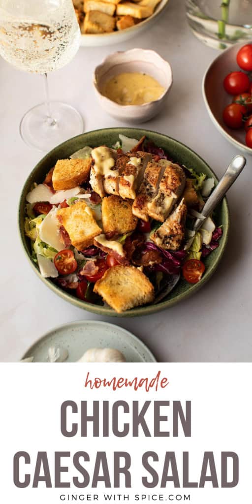Green bowl of chicken caesar salad with title text below. Pinterest pin.